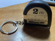 Load image into Gallery viewer, Shock Tape Measure - Jokes, Gags and Pranks - This Tape Measurer Is Shocking!