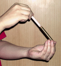 Load image into Gallery viewer, Cigarette Pierce - Brass Deluxe Pro Version - Cigarette Placed in Tube Is Unharmed by Nails!